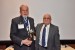 Dr. Nagib Callaos, General Chair, giving Prof. Stuart A. Umpleby an award "In Appreciation for Delivering a Great Workshop and Plenary Keynote Address."
